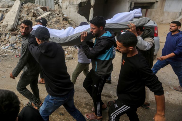 GAZA CITY, GAZA - MAY 16: (EDITOR'S NOTE: Image depicts death.) Friends and family gather at Al-Shifa hospital to mourn a victim of yesterday's airstrike on May 16, 2026 in Gaza City, Gaza. The person died after Israel hit a residential building and nearby car in the Remal area of Gaza City as it targeted a Hamas military commander. (Photo by Ahmad Hasaballah/Getty Images)