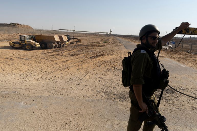 getty_6a14b04293-1779740738 KEREM SHALOM, GAZA STRIP - JULY 24: (EDITORS NOTE: Image has been reviewed by IDF prior to transmission) An Israeli soldier opens a gate to the Gaza Strip on July 24, 2025 in Kerem Shalom, Gaza Strip. The Israel Defense Forces (IDF) has led members of the media on a tour of the Kerem Shalom Crossing in Gaza, following international condemnation of Israel's blockade of humanitarian aid into Gaza. The World Health Organization has said it is "witnessing a deadly surge in malnutrition-related deaths," while more than 100 aid organizations, including Save the Children and Mèdecins Sans Frontières (Doctors Without Borders), issued an open letter warning of mass starvation in Gaza, and imploring Israeli authorities to provide safe access to food aid. Israel claims the hunger crisis in Gaza is a"man-made shortage engineered by Hamas." (Photo by Amir Levy/Getty Images)