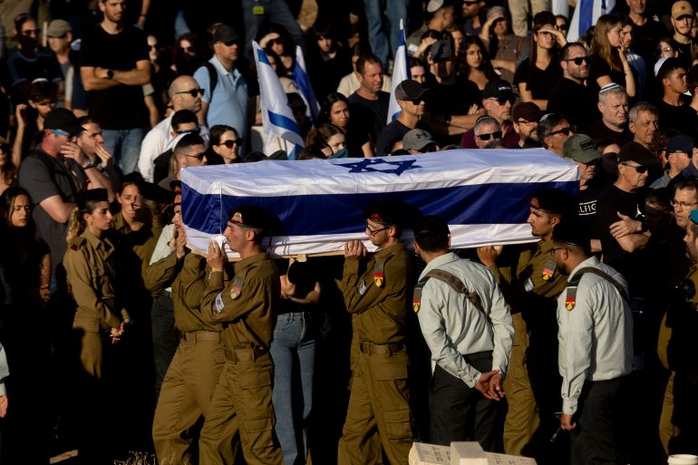 getty_6a181640e8-1779963456 ATLIT, ISRAEL - MAY 24: Israeli Soldiers carry a coffin covered with Israeli flag during a funeral service held for Israeli soldier Staff Sgt. Noam Hamburger on May 24, 2026 in Atlit, Israel. According to the Israel Defense Forces, Staff Sgt. Noam Hamburger, 23, was killed in a drone attack in northern Israel near the Lebanese border on Friday. (Photo by Amir Levy/Getty Images)