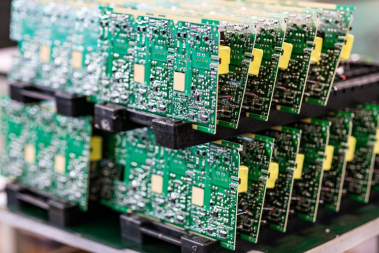 Blurred macro image of a row of microchips.