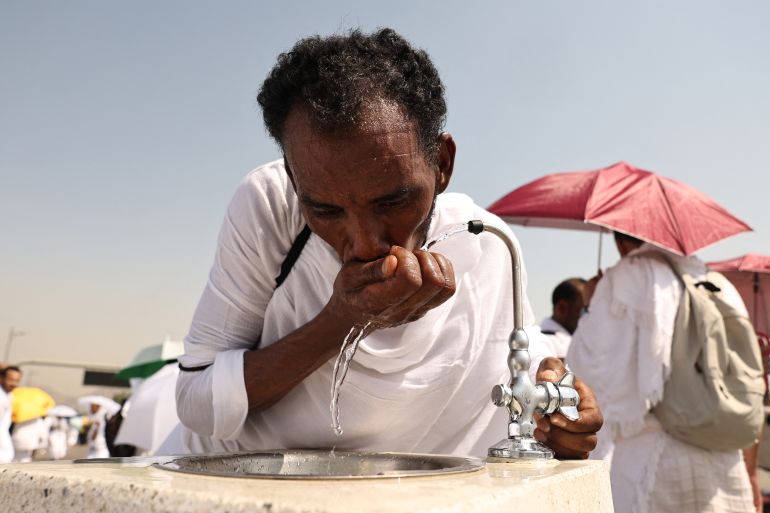 hajj6-1779272448 A Muslim pilgrim drinks from a water fountain at the base of Saudi Arabia's Mount Arafat, also known as Jabal al-Rahma or Mount of Mercy, during the climax of the Hajj pilgrimage on June 15, 2024. More than 1.5 million Muslims will pray on Mount Arafat in soaring temperatures on June 15, in the high-point and most gruelling day of the annual Hajj pilgrimage, one of the five pillars of Islam that must be performed at least once by all Muslims who have the means to do so. (Photo by Fadel Senna / AFP)