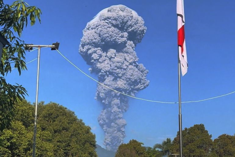 People watch as smoke rises after the eruption of Mount Dukono in North Halmahera Regency, North Maluku, Indonesia, May 8, 2026, in this screengrab obtained from a social media video. Jhon Frengki Manipa/via REUTERS THIS IMAGE HAS BEEN SUPPLIED BY A THIRD PARTY. MANDATORY CREDIT. NO RESALES. NO ARCHIVES. Verification Lines: - Buildings, flagpole, floor and basketball stand matched file and satellite images. - Date verified by original file metadata.