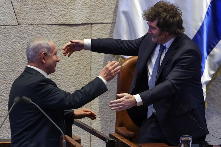 isr-arg-3-1779131854 Israeli Prime Minister Benjamin Netanyahu hugs Argentine President Javier Milei during a Plenum session of the Knesset, Israel's Parliament, in Jerusalem, June 11, 2025 REUTERS/Ronen Zvulun