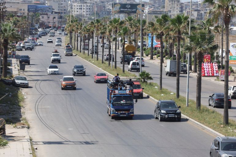 People sit on top of a vehicle as displaced people flee their homes in southern Lebanon following Israeli evacuation orders, in Sidon, Lebanon, April 27, 2026. REUTERS/Aziz Taher
