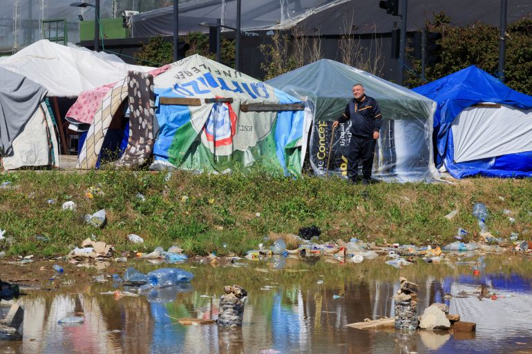 Kheder Hammoud, a displaced man from Kfar Kila village in southern Lebanon, walks at a makeshift encampment in Beirut, Lebanon, April 7, 2026. REUTERS/Mohamed Azakir