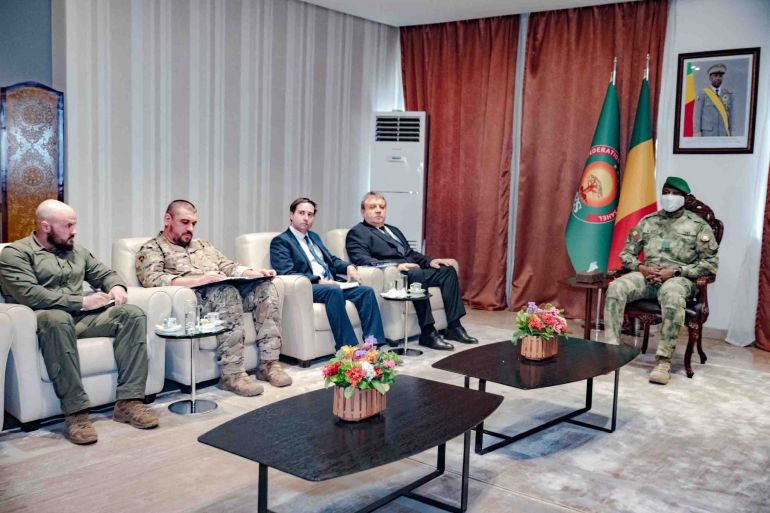 Mali's junta leader, Assimi Goita, right, meets the Russian ambassador to Mali, Igor Gromyko, second right, and other military and diplomatic officials at the Presidency Palace in Bamako, Mali, Tuesday, April 28, 2026. (Mali Presidency via AP)