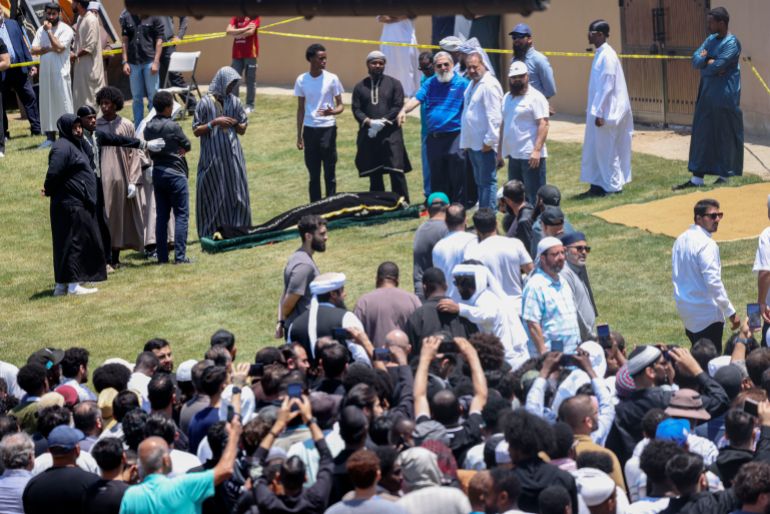 SAN DIEGO, CALIFORNIA - MAY 21: People attend the funeral service for Amin Abdullah, Mansour Kaziha, and Nadir Awad, at La Vista Memorial Park in National City on May 21, 2026 in San Diego, California. The services honor the three men who were killed trying to stop two teenage gunmen from entering the Islamic Center of San Diegos mosque and school. Sandy Huffaker/Getty Images/AFP (Photo by Sandy Huffaker / GETTY IMAGES NORTH AMERICA / Getty Images via AFP)