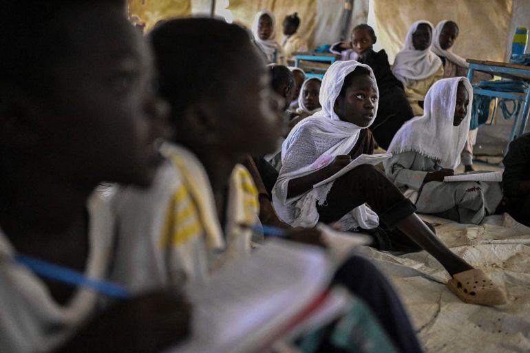 nicef10-1777631645 Displaced Sudanese students attend a class at an elementary school run by the Sudanese Coalition for Education in partnership with the United Nations International Children's Emergency Fund (UNICEF), south of Port Sudan, on April 26, 2026. In Sudan, where a war between the army and the paramilitary Rapid Support Forces has killed tens of thousands and triggered one of the worlds largest humanitarian crises, more than eight million children are currently out of school, according to the UNs childrens agency. (Photo by Khaled DESOUKI / AFP)