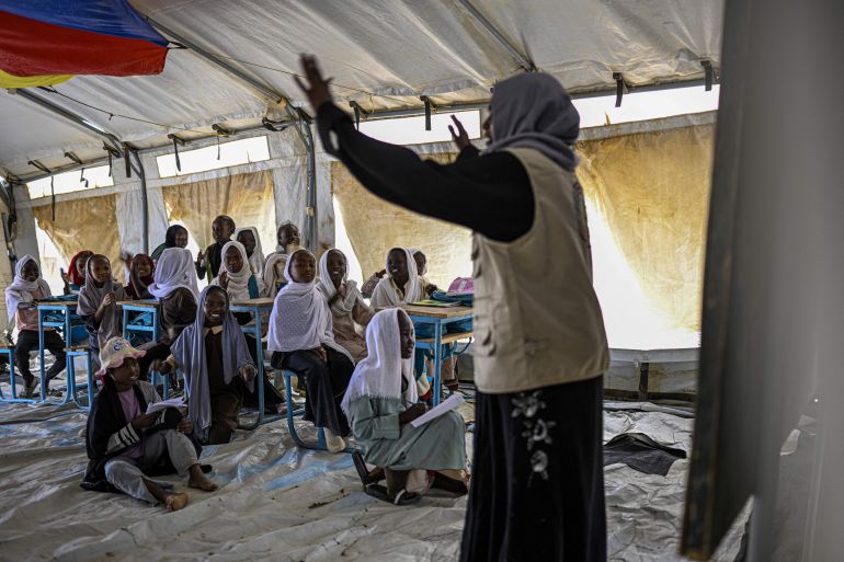 nicef11-1777631650 Displaced Sudanese students attend a class at an elementary school run by the Sudanese Coalition for Education in partnership with the United Nations International Children's Emergency Fund (UNICEF), south of Port Sudan, on April 26, 2026. In Sudan, where a war between the army and the paramilitary Rapid Support Forces has killed tens of thousands and triggered one of the worlds largest humanitarian crises, more than eight million children are currently out of school, according to the UNs childrens agency. (Photo by Khaled DESOUKI / AFP)