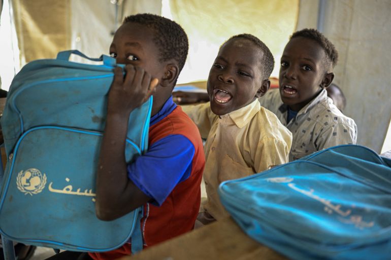 nicef5-1777631617 Displaced Sudanese students attend a class at an elementary school run by the Sudanese Coalition for Education in partnership with the United Nations International Children's Emergency Fund (UNICEF), south of Port Sudan, on April 26, 2026. In Sudan, where a war between the army and the paramilitary Rapid Support Forces has killed tens of thousands and triggered one of the worlds largest humanitarian crises, more than eight million children are currently out of school, according to the UNs childrens agency. (Photo by Khaled DESOUKI / AFP)
