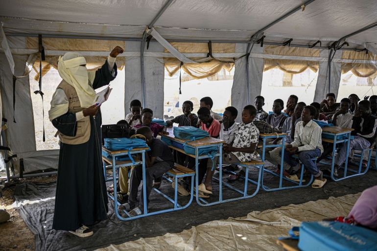nicef7-1777631631 Displaced Sudanese students attend a class at an elementary school run by the Sudanese Coalition for Education in partnership with the United Nations International Children's Emergency Fund (UNICEF), south of Port Sudan, on April 26, 2026. In Sudan, where a war between the army and the paramilitary Rapid Support Forces has killed tens of thousands and triggered one of the worlds largest humanitarian crises, more than eight million children are currently out of school, according to the UNs childrens agency. (Photo by Khaled DESOUKI / AFP)
