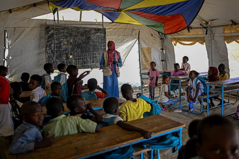 nicef9-1777631640 Displaced Sudanese students attend a class at an elementary school run by the Sudanese Coalition for Education in partnership with the United Nations International Children's Emergency Fund (UNICEF), south of Port Sudan, on April 26, 2026. In Sudan, where a war between the army and the paramilitary Rapid Support Forces has killed tens of thousands and triggered one of the worlds largest humanitarian crises, more than eight million children are currently out of school, according to the UNs childrens agency. (Photo by Khaled DESOUKI / AFP)