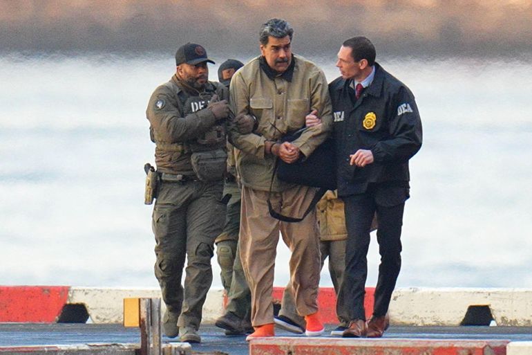 NEW YORK, NY - JANUARY 5: Nicolas Maduro is seen in handcuffs after landing at a Manhattan helipad, escorted by heavily armed Federal agents as they make their way into an armored car en route to a Federal courthouse in Manhattan on January 5, 2026 in New York City. (Photo by XNY/Star Max/GC Images)