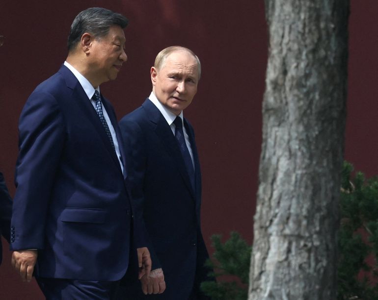 Chinese President Xi Jinping and Russian President Vladimir Putin walk at the personal residence of the Chinese leader Zhongnanhai in Beijing, China September 2, 2025. Sputnik/Alexander Kazakov/Pool via REUTERS ATTENTION EDITORS - THIS IMAGE WAS PROVIDED BY A THIRD PARTY.