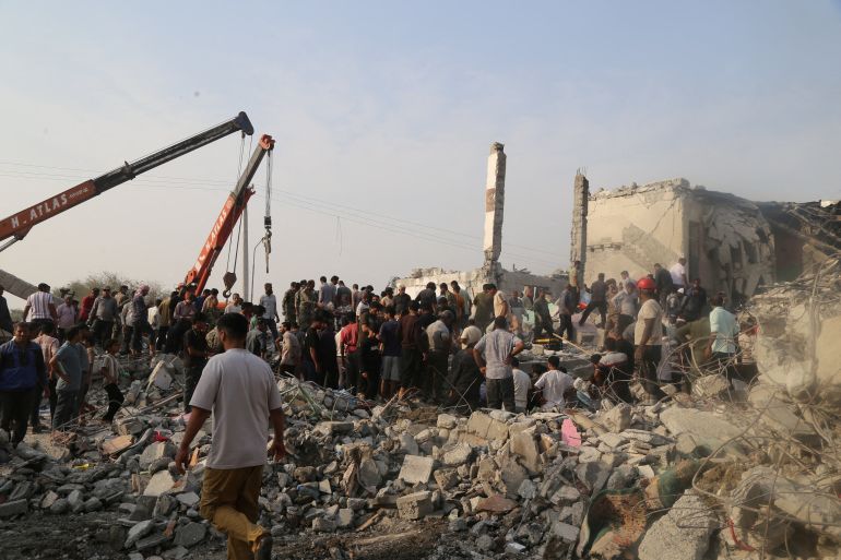 People and rescue forces work following a reported strike on a school in Minab, Iran, February 28, 2026. Abbas Zakeri/Mehr News/WANA (West Asia News Agency) via REUTERS ATTENTION EDITORS - THIS PICTURE WAS PROVIDED BY A THIRD PARTY. REFILE – REMOVING ATTRIBUTION TO STRIKE