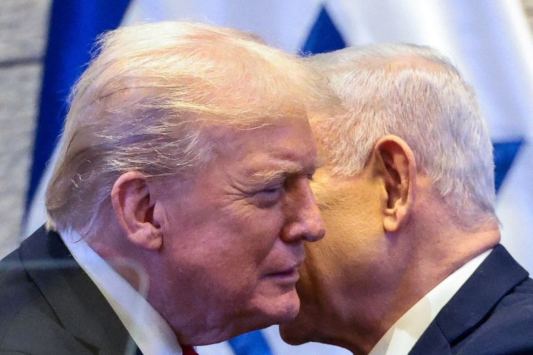 FILE PHOTO: U.S. President Donald Trump and Israeli Prime Minister Benjamin Netanyahu at the Knesset on the day of Trump's address, amid a U.S.-brokered prisoner-hostage swap and ceasefire deal between Israel and Hamas, in Jerusalem, October 13, 2025. REUTERS/Evelyn Hockstein/Pool/File Photo