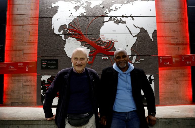 FILE PHOTO: Pierre Guillon de Prince, a 83-year-old descendant of a famous Nantes family whose ancestors were owners of ships transporting enslaved people, and Dieudonne Boutrin, a 59-year-old descendant of enslaved Africans in Martinique, president of the association La Coque Nomade-Fraternite, a human right association in Nantes which campaigns on slavery and reparations, pose at the Memorial to the Abolition of Slavery in Nantes, France, March 23, 2024. REUTERS/Stephane Mahe/File Photo