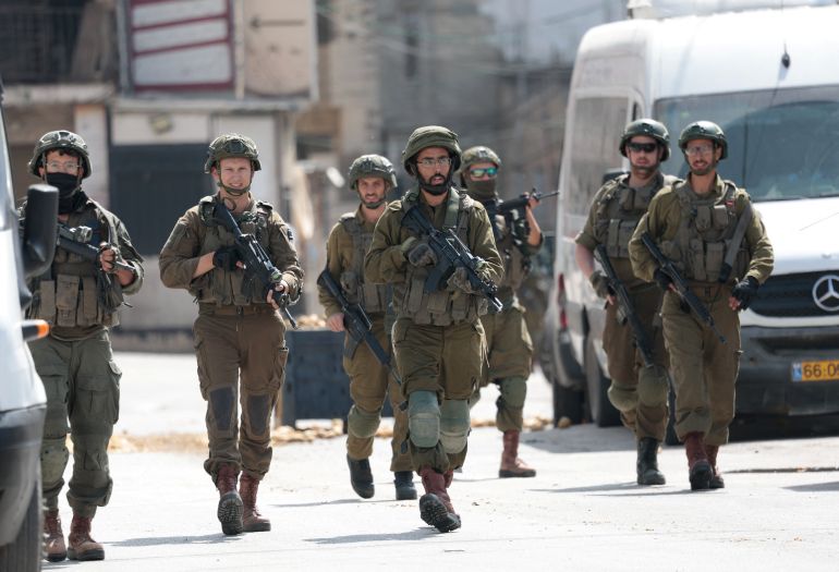 reuters_69f1a8db-1777445083 Members of the Israeli forces take part in a raid in Qalandya, in the Israeli-occupied West Bank, April 27, 2026. REUTERS/Mohammed Torokman
