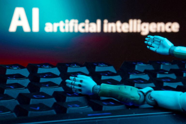 FILE PHOTO: FILE PHOTO: A message reading "AI artificial intelligence," a keyboard and robot hands are seen in this illustration created on January 27, 2025. REUTERS/Dado Ruvic/Illustration//File Photo/File Photo