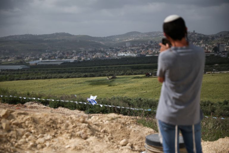 A boy takes a picture on the day of the re-establishment of the settlement of Sa-Nur, which was evacuated as part of Israel's 2005 disengagement, in Sa-Nur in the Israeli-occupied West Bank, April 19, 2026. REUTERS/Shir Torem