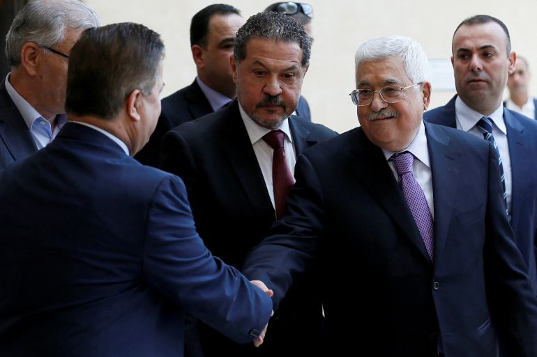reuters_6a0556d0-1778734800 Palestinian President Mahmoud Abbas, accompanied by his son Yasser, leaves a hospital in Ramallah in the Israeli-occupied West Bank, May 28, 2018. REUTERS/Mohamad Torokman