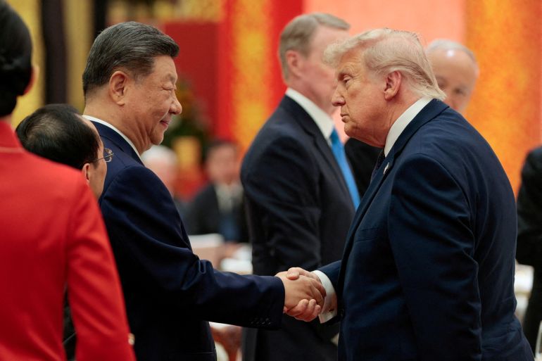 reuters_6a05dda5-1778769317 Chinese President Xi Jinping and U.S. President Donald Trump shake hands at a state banquet at the Great Hall of the People in Beijing, China, May 14, 2026. REUTERS/Evan Vucci TPX IMAGES OF THE DAY