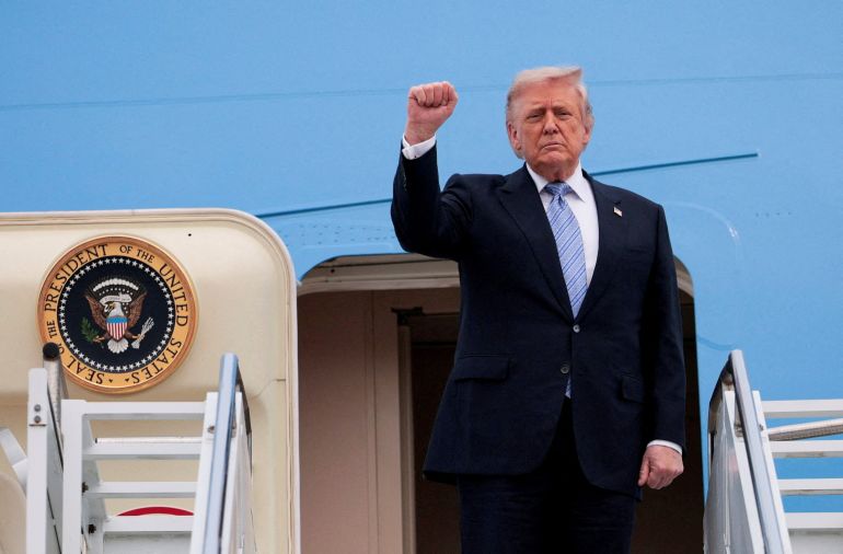 FILE PHOTO: U.S. President Donald Trump gestures as he departs Beijing Capital International Airport aboard Air Force One, in Beijing, China, May 15, 2026. REUTERS/Evan Vucci REFILE - QUALITY REPEAT/File Photo