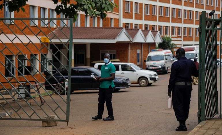 Workers stand guard at the gate of the Kibuli Muslim Hospital where a Congolese man died of Ebola Bundibugyo virus in Kibuli suburb of Kampala, Uganda May 16, 2026. REUTERS/Abubaker Lubowa
