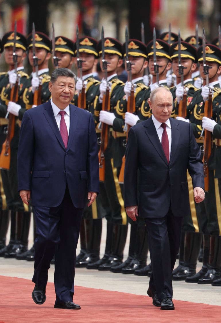 reuters_6a0d3304-1779249924 Russian President Vladimir Putin and Chinese President Xi Jinping inspect an honor guard during a welcoming ceremony at the Great Hall of the People in Beijing, China May 20, 2026. REUTERS/Maxim Shemetov/Pool