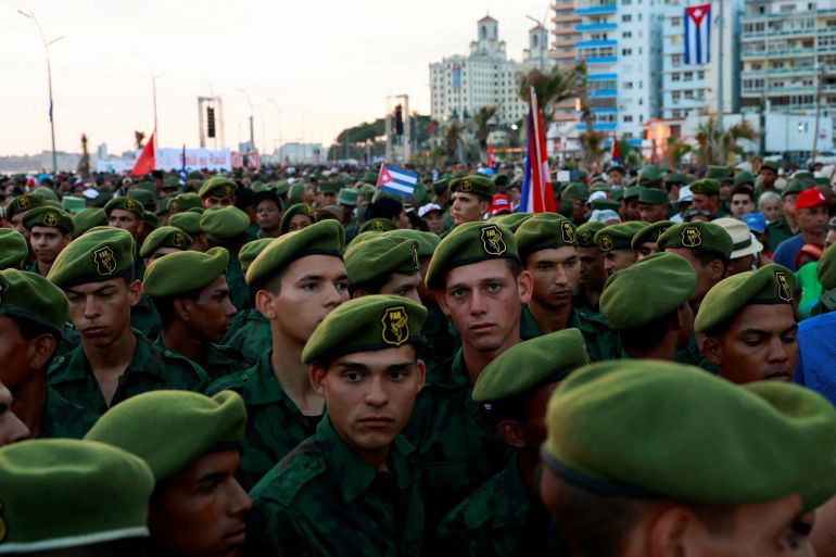 reuters_6a10a4c0-1779475648 Members of the Revolutionary Armed Forces gather on the day of a pro-government rally called by Cuban authorities to protest U.S. policies toward the island, including the indictment of former Cuban president Raul Castro, in Havana, Cuba, May 22, 2026. REUTERS/Norlys Perez TPX IMAGES OF THE DAY