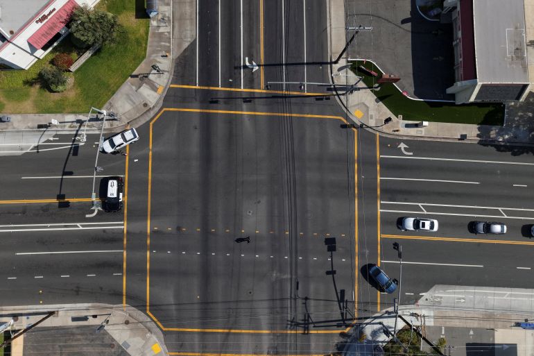 reuters_6a118af3-1779534579 A drone picture shows law enforcement officers blocking a roadway as a chemical incident involving a failing tank of flammable liquid called methyl methacrylate, used in the aerospace industry, has forced an evacuation in the surrounding area in Garden Grove, California, U.S. May, 22, 2026. REUTERS/ Caroline Brehman