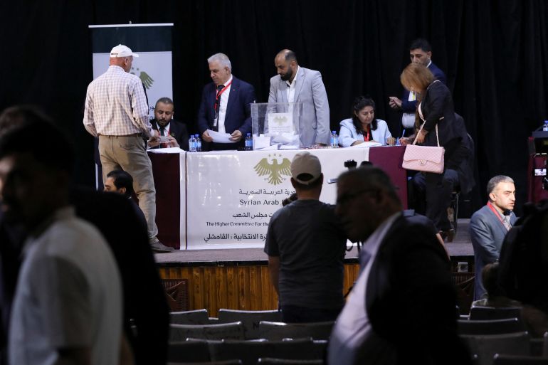 Members of the electoral colleges vote to select candidates for the new Syrian Parliament since Bashar al-Assad's government was toppled, in Hasakah, Syria, May 24, 2026. REUTERS/Orhan Qereman
