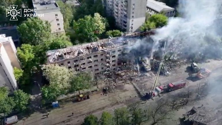 reuters_6a1308f3-1779632371 A drone view of smoke rising from a damaged building following a Russian strike, amid Russia's attack on Ukraine, in Kyiv, Ukraine, May 24, 2026, in this screengrab from a handout video. State Emergency Service of Ukraine/Handout via REUTERS THIS IMAGE HAS BEEN SUPPLIED BY A THIRD PARTY. MANDATORY CREDIT. DO NOT OBSCURE LOGO.