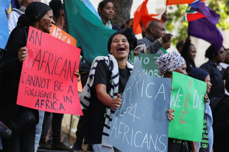 People from migrant rights organisations demonstrate outside St George's Cathedral on Africa Day, protesting against ongoing nationwide anti-illegal immigration protests, in Cape Town, South Africa, May 25, 2026. REUTERS/Esa Alexander