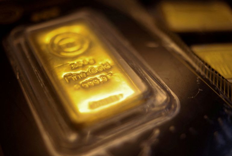 FILE PHOTO: A gold bar marked with the letters "BTC" (out of focus) is displayed at a jewellery shop at the Al Moez Street gold market in Old Cairo as demand for gold bars and coins rises in Egypt, with buyers seeking a safer store of value amid volatile markets and economic uncertainty, traders and industry officials said, in Cairo, Egypt, February 5, 2026. REUTERS/Amr Abdallah Dalsh/File Photo