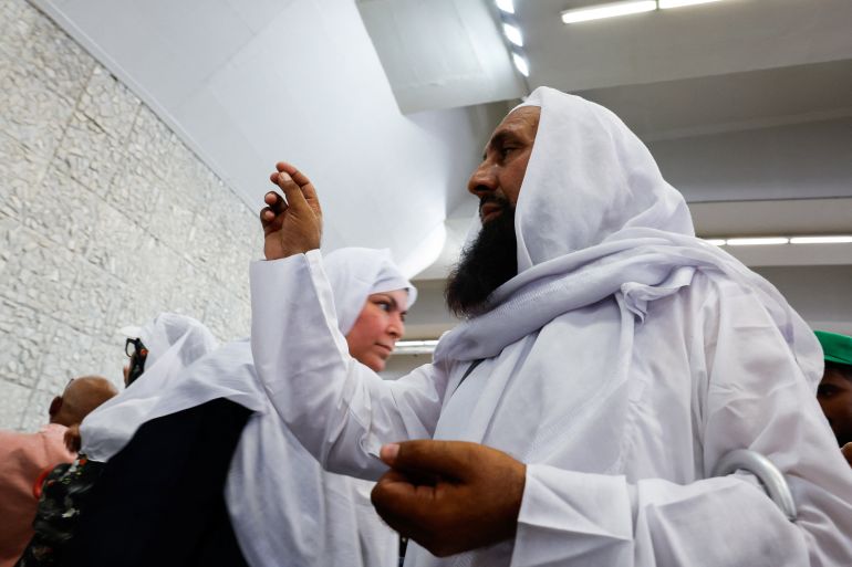 reuters_6a184f5a-1779978074 Muslim pilgrims cast stones at a pillar symbolising Satan on the second day of the stoning ritual, during the annual hajj pilgrimage in Mina, Saudi Arabia, May 28, 2026. REUTERS/Ibraheem Abu Mustafa
