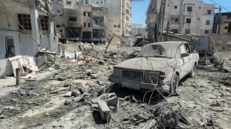 A damaged vehicle lies amidst the rubble at the site of an Israeli strike in Tyre, Lebanon, May 28, 2026. REUTERS/Stringer
