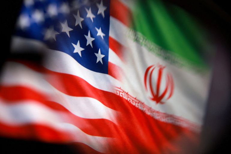 FILE PHOTO: U.S. and Iranian flags are seen in this illustration taken March 23, 2026. REUTERS/Dado Ruvic/Illustration/File Photo