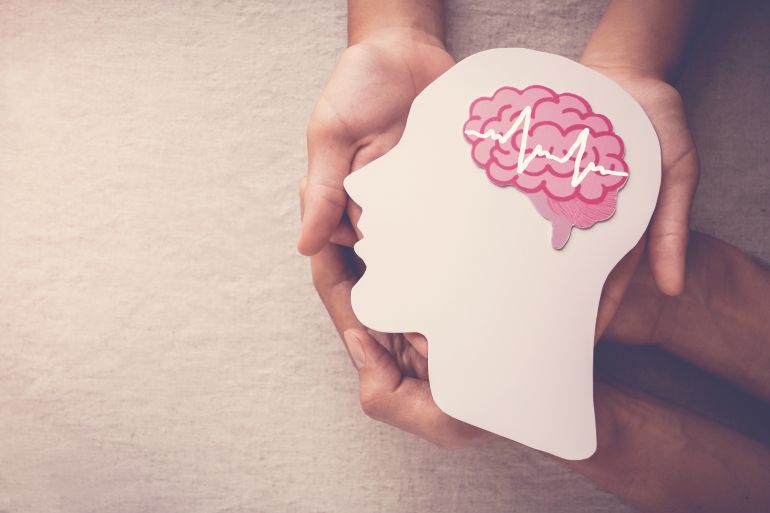 seizures2-1737619360 Adult and child hands holding encephalography brain paper cutout,autism, Stroke, Epilepsy and alzheimer awareness, seizure disorder, stroke, ADHD, world mental health day concept