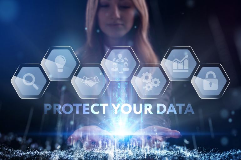 shutterstock_1853230348-1779087940 Business, Technology, Internet and network concept. Young businessman working on a virtual screen of the future and sees the inscription: Protect your data