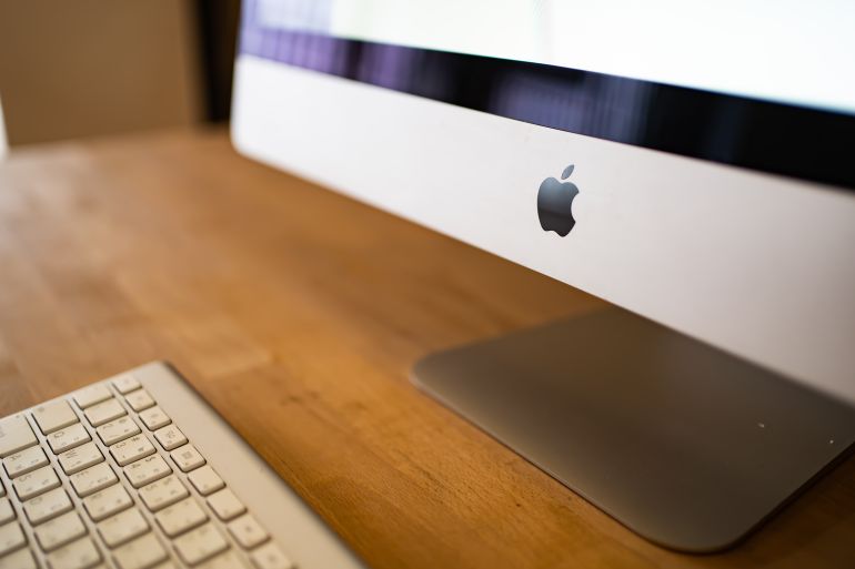 shutterstock_2122523978-1778510406 Bangkok, Thailand - February 12, 2022: Apple Inc. logo on iMac computer.