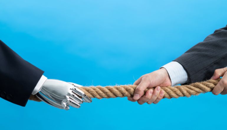 Human and robot play tug of war.