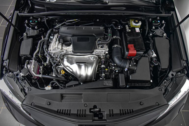 shutterstock_2394048607-1769942406 The engine compartment of a passenger car.