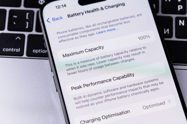 smartphone iPhone with Battery Health and Charging settings interface on a screen. Apple is a multinational technology company. Batumi, Georgia - November 24, 2023