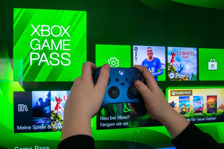Mainz, Germany - 04.26.2023: Joystick controller in the hand. Gaming consoles the Xbox Series X and Xbox Series S. For play video games.