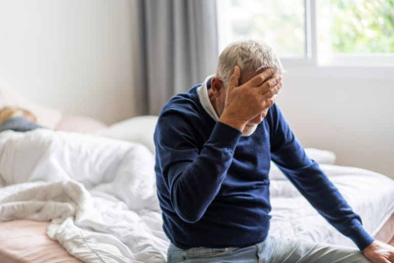 shutterstock_2489209413-1739806592 Sick unhappy senior elderly man touching head serious depressed feeling headache thinking of problem, alzheimer, cancer, stroke, parkinson, disease and cerebral haemorrage
