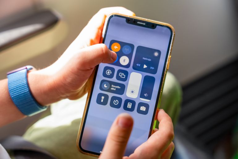Prague, Czech Republic - July 5, 2024: The child turned on airplane mode on the plane