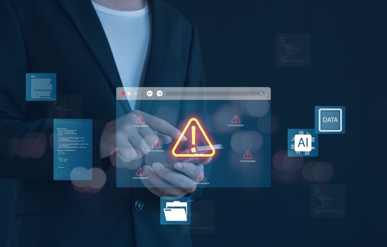 shutterstock_2682188251-1779087932 Artificial intelligence warning with data security alert, mobile device risk, cyber attack, AI system error, and digital technology danger concept for business, network safety,แปลไทย (191 ตัวอักษร):
