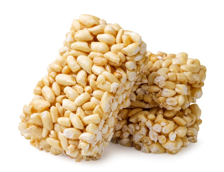 Puffed rice bar close-up on a white background. Isolated