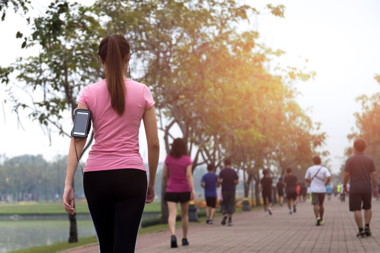 Group of people exercise walking